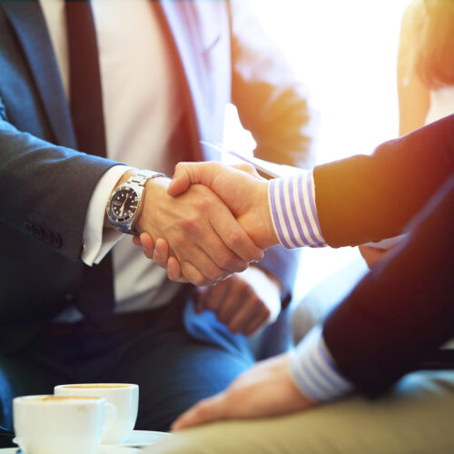 Business people shaking hands, finishing up a meeting